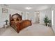 Spacious main bedroom featuring neutral walls, carpet, and plenty of natural light at 4085 Sw 110Th St, Ocala, FL 34476