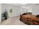 Spacious main bedroom with large windows and neutral carpet, offering a bright and airy feel at 4085 Sw 110Th St, Ocala, FL 34476