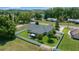 Aerial view of a home with a well-manicured lawn and a screened-in porch and a pergola at 4401 Sw 44Th Ln, Ocala, FL 34474