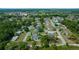 Neighborhood aerial view with well-maintained lawns, mature trees, and easy access to nearby amenities at 4401 Sw 44Th Ln, Ocala, FL 34474