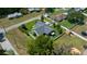 Aerial view of a beautiful home with a fenced-in backyard, a screened-in porch, and a pergola at 4401 Sw 44Th Ln, Ocala, FL 34474