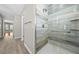 Bathroom showcasing a shower with decorative tile and a built-in shower bench at 4401 Sw 44Th Ln, Ocala, FL 34474