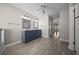 Bright bathroom featuring double vanities, gray cabinets, and tile flooring at 4401 Sw 44Th Ln, Ocala, FL 34474