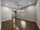 Neutral bedroom features hard wood floors, a ceiling fan, and a mirrored closet at 4401 Sw 44Th Ln, Ocala, FL 34474
