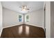 Bedroom features hardwood floors, windows letting in lots of natural light and a ceiling fan at 4401 Sw 44Th Ln, Ocala, FL 34474