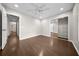 Bedroom featuring hard wood floors, a ceiling fan, a large window, and a walk in closet at 4401 Sw 44Th Ln, Ocala, FL 34474