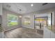 Breakfast nook with two large windows overlooking the backyard and sliding door to the florida room at 4401 Sw 44Th Ln, Ocala, FL 34474