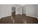 Open-concept dining room with hardwood floors and modern light fixture at 4401 Sw 44Th Ln, Ocala, FL 34474