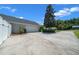 Charming home with a large driveway, a two-car garage, and white fence for privacy at 4401 Sw 44Th Ln, Ocala, FL 34474