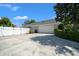 Charming home with a large driveway, a two-car garage, and white fence for privacy at 4401 Sw 44Th Ln, Ocala, FL 34474