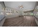 Bright and airy Florida room with multiple windows and ceiling fans at 4401 Sw 44Th Ln, Ocala, FL 34474