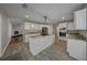 Spacious kitchen features an island, granite countertops, stainless steel appliances, and ample cabinet space at 4401 Sw 44Th Ln, Ocala, FL 34474