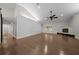 Open living room with high ceilings, wood floors, a fireplace, and lots of natural light at 4401 Sw 44Th Ln, Ocala, FL 34474