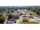 Expansive aerial view of a neighborhood featuring well-maintained homes, manicured lawns, and lush landscaping at 4763 Se 25Th Loop, Ocala, FL 34480