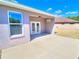 This home has a covered back porch and a view of a lawn at 4763 Se 25Th Loop, Ocala, FL 34480