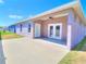 Backyard with covered patio, ceiling fan, and a grassy lawn at 4763 Se 25Th Loop, Ocala, FL 34480