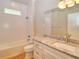 This bathroom features a tiled shower, granite countertops and updated fixtures at 4763 Se 25Th Loop, Ocala, FL 34480