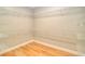 Walk-in closet featuring custom shelving and wood flooring at 4763 Se 25Th Loop, Ocala, FL 34480