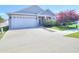 Charming one-story home with a two-car garage, attractive landscaping, and a well-maintained lawn at 4763 Se 25Th Loop, Ocala, FL 34480