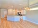 Bright kitchen with white cabinets, a breakfast bar, and stainless steel appliances at 4763 Se 25Th Loop, Ocala, FL 34480