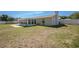 Home featuring an enclosed lanai and a spacious, fenced backyard at 4810 County Road 114, Wildwood, FL 34785