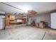 Unfinished basement with exposed brickwork, storage cabinets, and potential for customization at 4810 County Road 114, Wildwood, FL 34785