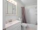 Bathroom featuring a tub/shower combination, toilet and sink/vanity with medicine cabinet and light at 4810 County Road 114, Wildwood, FL 34785