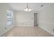 Dining room with tile floors, a modern chandelier, and ample natural light at 4810 County Road 114, Wildwood, FL 34785