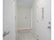Bright entryway with tiled flooring, a front door with a window and multiple closet doors at 4810 County Road 114, Wildwood, FL 34785