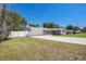 Single-story home with white garage door, well maintained yard, and brick accent architecture at 4810 County Road 114, Wildwood, FL 34785