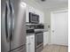 Close up view of kitchen featuring stainless steel appliances and updated cabinetry at 4810 County Road 114, Wildwood, FL 34785