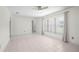 Open living area with tile flooring, fan, and window overlooking outdoors for natural light at 4810 County Road 114, Wildwood, FL 34785