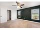 Bedroom features a ceiling fan, large windows and a walk-in closet at 5591 Nw 57Th Pl, Ocala, FL 34482