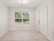 Bright dining area with tile floors, modern lighting, and large window overlooking the yard at 5591 Nw 57Th Pl, Ocala, FL 34482
