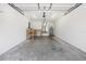 Spacious garage with workbench and water heater at 5591 Nw 57Th Pl, Ocala, FL 34482