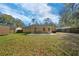 Well maintained back yard with mature trees and patio at 5900 Nw 61St Ct, Ocala, FL 34482