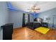 Bedroom features wood-look floors, ceiling fan, and overhead LED accent lighting at 5900 Nw 61St Ct, Ocala, FL 34482
