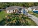 Charming single-Gathering home featuring a manicured lawn and an attached two-car garage at 5900 Nw 61St Ct, Ocala, FL 34482
