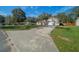 Charming single-Gathering home featuring a manicured lawn and an attached two-car garage at 5900 Nw 61St Ct, Ocala, FL 34482