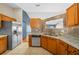 Well-lit kitchen with stainless steel appliances and counter seating offers ample space at 5900 Nw 61St Ct, Ocala, FL 34482