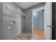 Cozy laundry room includes washer and dryer hookups and laminate flooring at 5900 Nw 61St Ct, Ocala, FL 34482