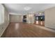 Open living area with hardwood floors, natural light, and view to the kitchen at 5900 Nw 61St Ct, Ocala, FL 34482