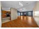 Large living room with hardwood floors, and view of kitchen offers plenty of space at 5900 Nw 61St Ct, Ocala, FL 34482