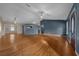 Spacious living room features hardwood floors, ceiling fan, and great natural light at 5900 Nw 61St Ct, Ocala, FL 34482