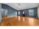 Bright living room features hardwood floors, high ceilings, and abundant natural light at 5900 Nw 61St Ct, Ocala, FL 34482