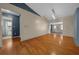 Modern living room boasts hardwood floors, lots of space, and access to other rooms at 5900 Nw 61St Ct, Ocala, FL 34482