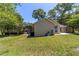 A well-maintained backyard with a screened-in pool area creates a private oasis at 6150 Nw 59Th Ave, Ocala, FL 34482