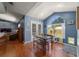 Cozy dining area with lots of natural light and wood floors at 6150 Nw 59Th Ave, Ocala, FL 34482
