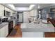 Functional kitchen with stainless steel appliances and peninsula counter at 6150 Nw 59Th Ave, Ocala, FL 34482