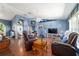 Large living area with hardwood floors, stylish decor, and an open layout at 6150 Nw 59Th Ave, Ocala, FL 34482